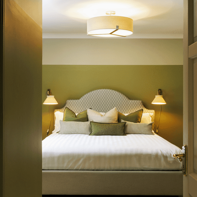 Luxurious hotel room with a king-size bed, plush pillows, soft lighting, modern ensuite bathroom, perfect for relaxation.