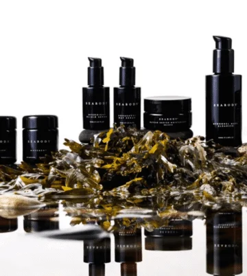 Luxurious spa products elegantly displayed with natural seaweed, offering a serene wellness experience.